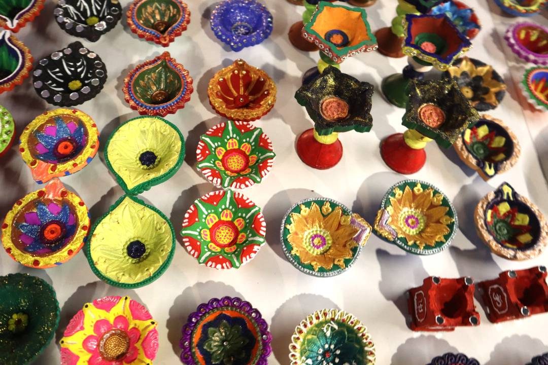 Hand-painted diyas created by employees for the Diwali fundraiser
